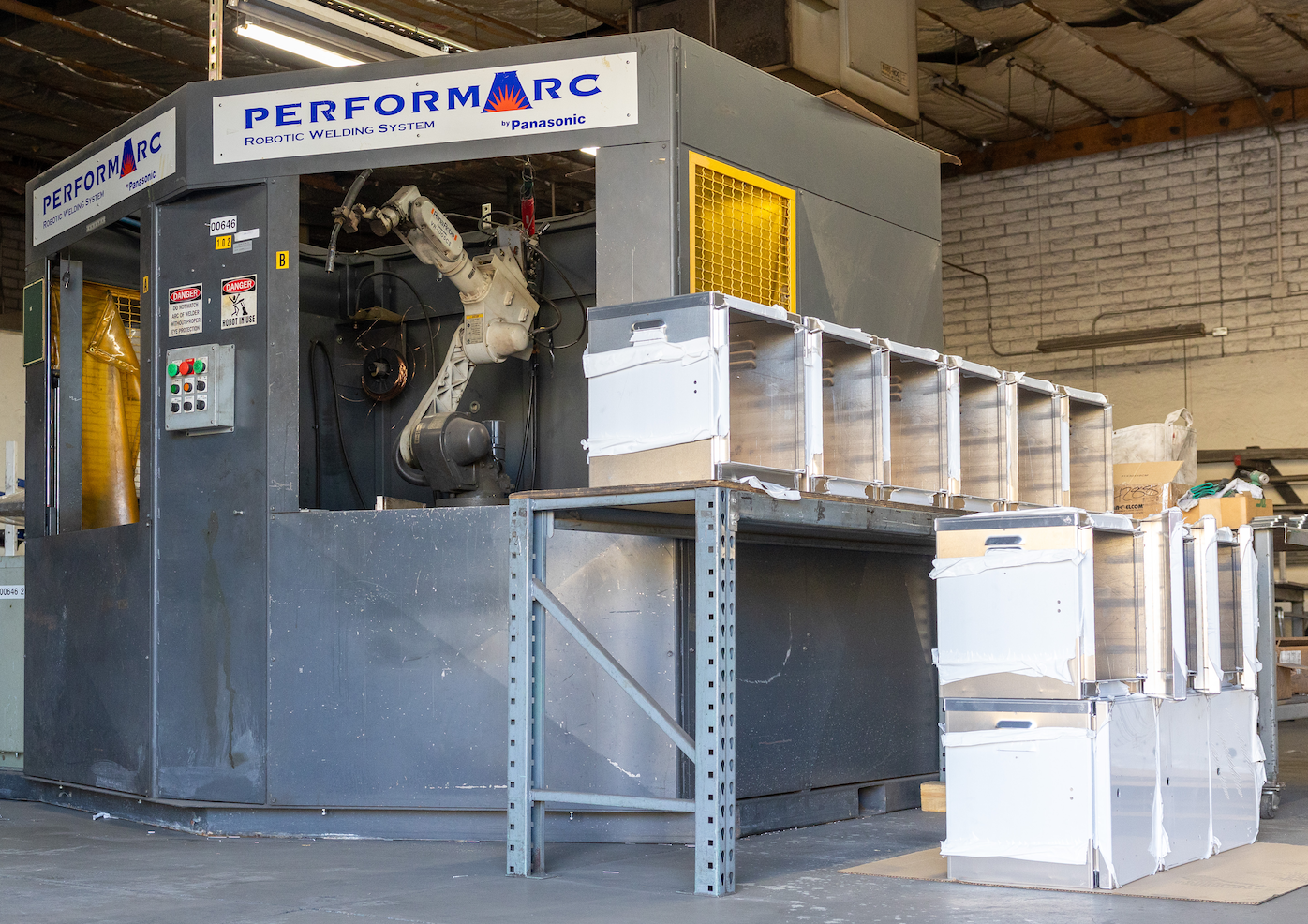Solar cabinets staged next to the robotic weld cell