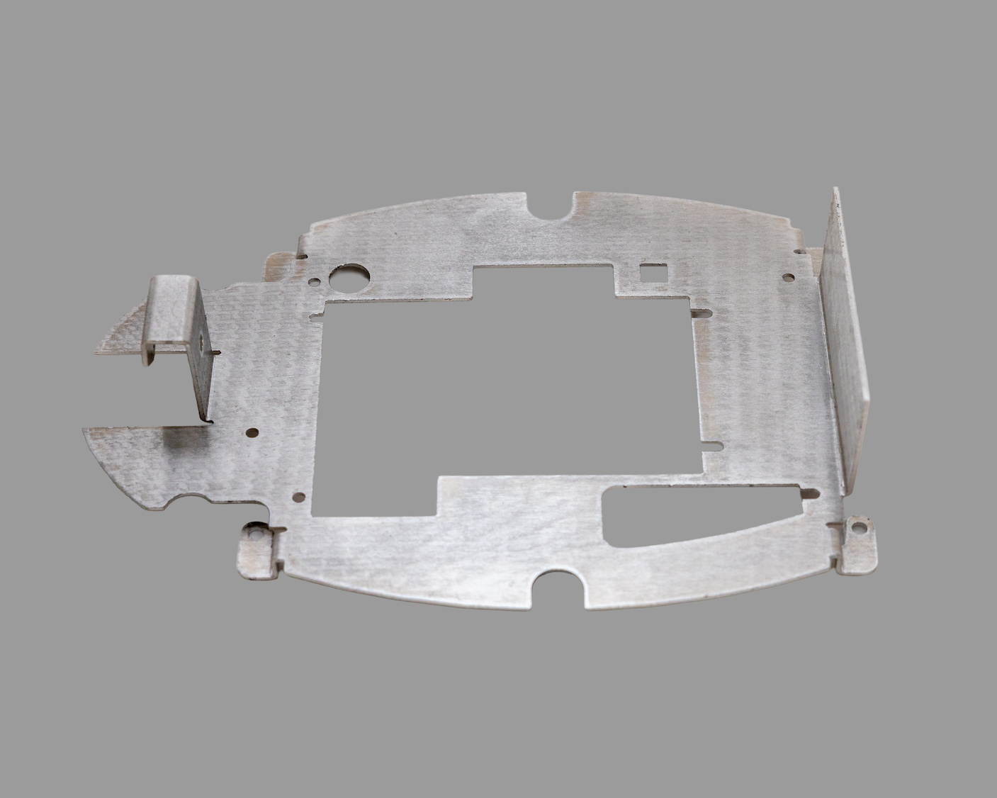Precision cut and formed phone dock plate